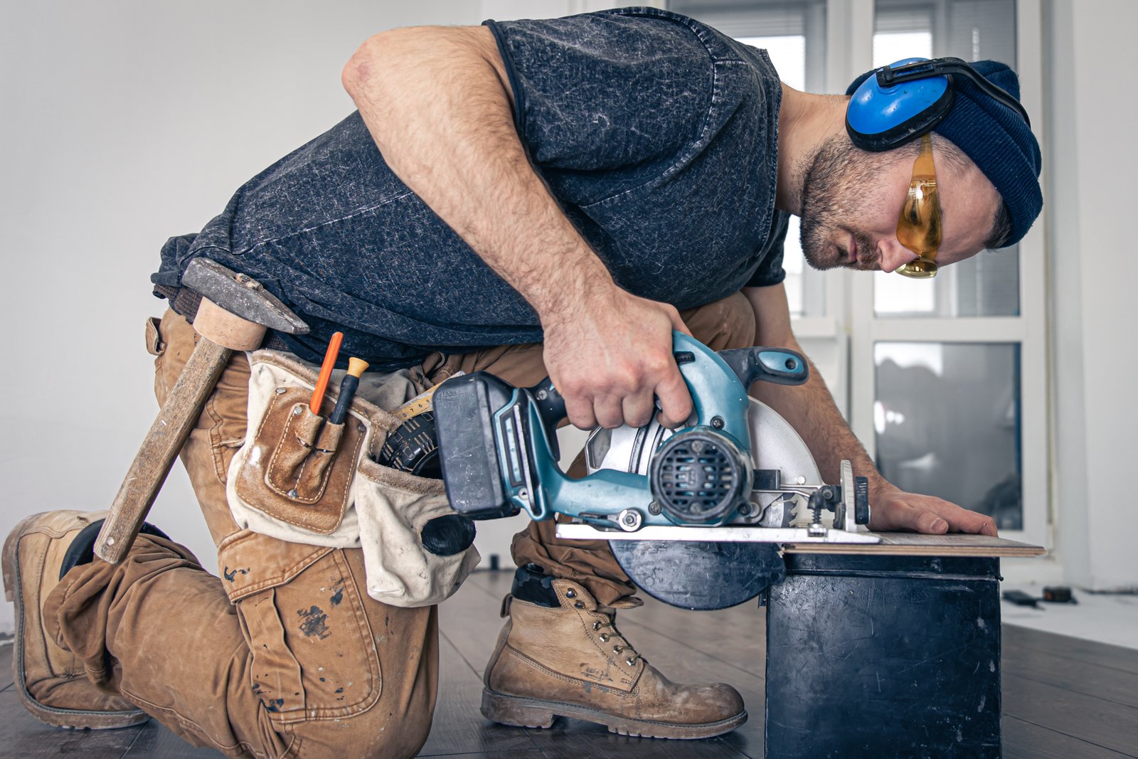 Carpenter using circular saw for remodeling work